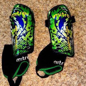 Mitre soccer shin guards.